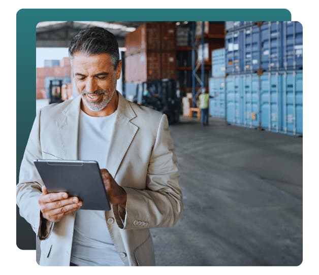 Distribution executive reviewing operations on a tablet, professional and executive search recruiting