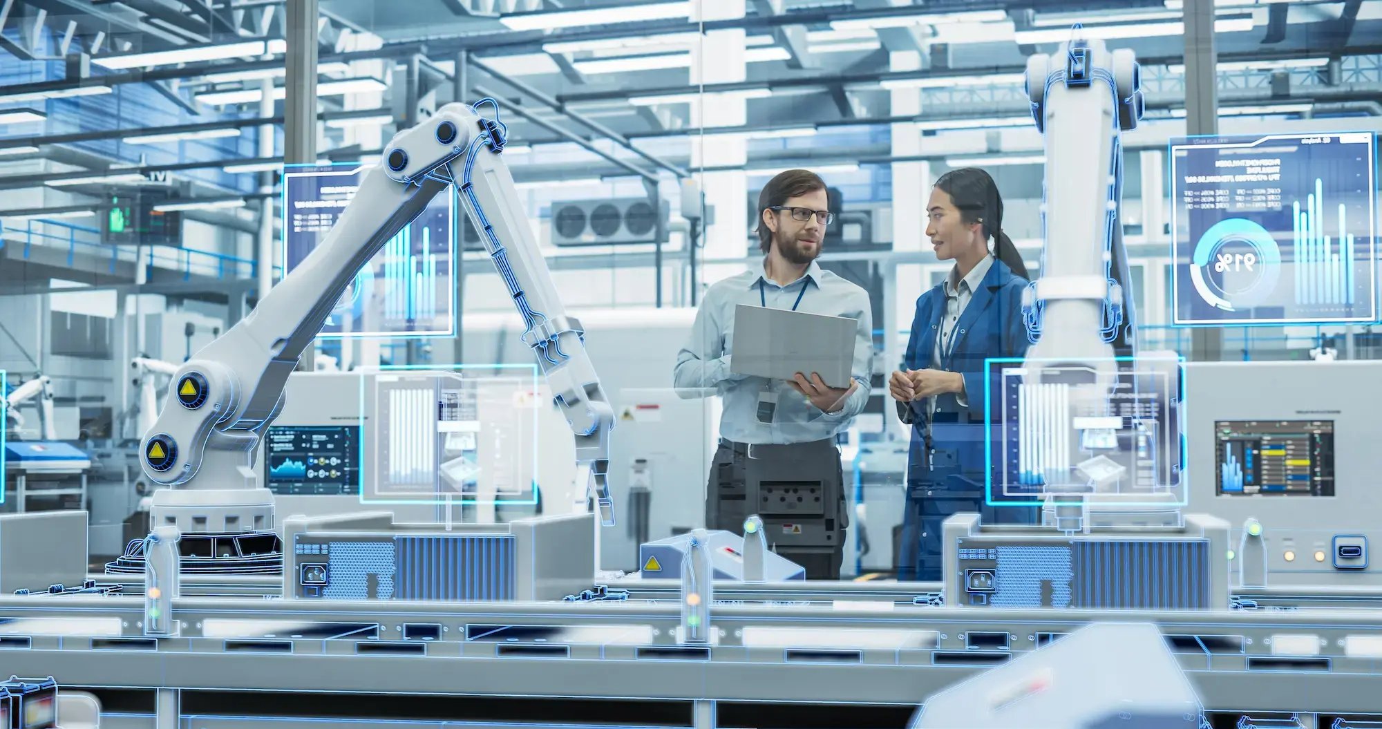 Leaders reviewing data in a smart factory, industrial technology recruiters, executive and professional search